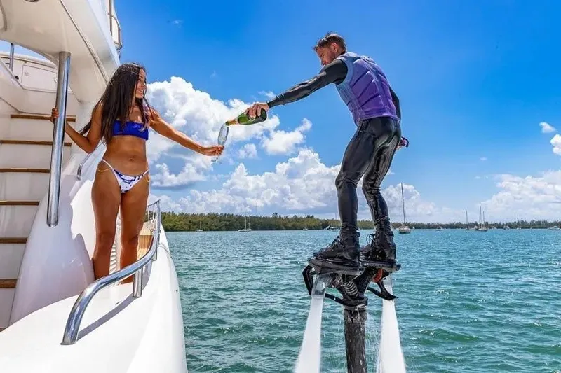 Slide: The Image of Man on flyboard pouring champagne to woman on Sunseeker Manhattan 74 yacht, 2000 model. - 41