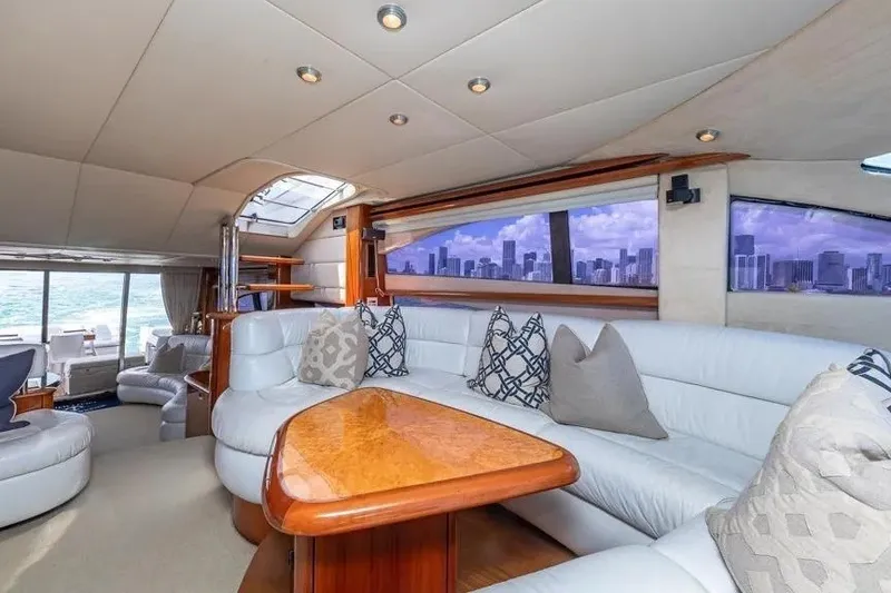 Slide: The Image of Luxurious interior of 2000 Sunseeker Manhattan 74 yacht with elegant seating and city skyline view. - 32