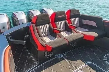 Slide: The Image of 2021 Concept 44' Open Deck boat with luxurious seating and multiple engines on a sunny day. - 33