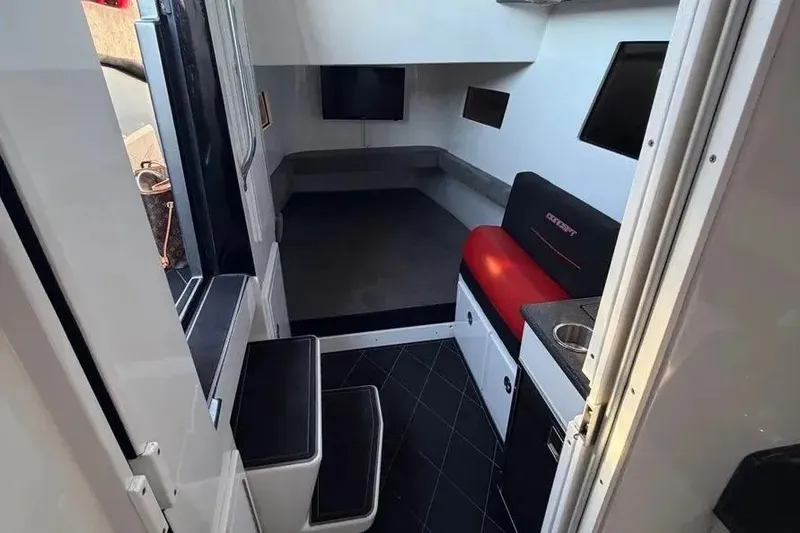 Slide: The Image of Interior of 2021 Concept 44' Open Deck boat with modern seating and compact kitchenette. - 55