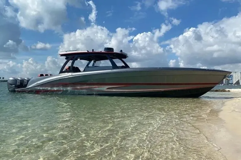 Slide: The Image of 2021 Concept 44' Open Deck boat on clear water near sandy beach. - 36