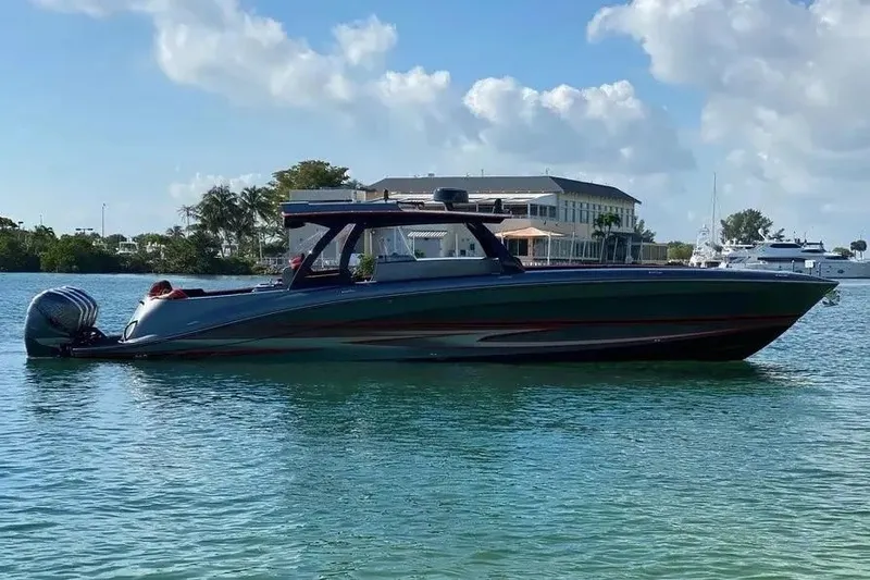 Slide: The Image of 2021 Concept 44' Open Deck boat on calm water, with a scenic background. - 31