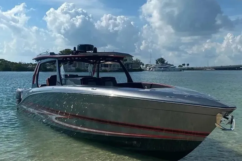 Slide: The Image of 2021 Concept 44' Open Deck boat on calm water under a cloudy sky. - 46
