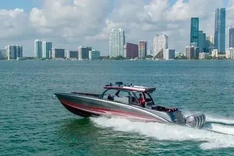 Slide: The Image of 2021 Concept 44' Open Deck boat cruising near city skyline on a sunny day. - 41