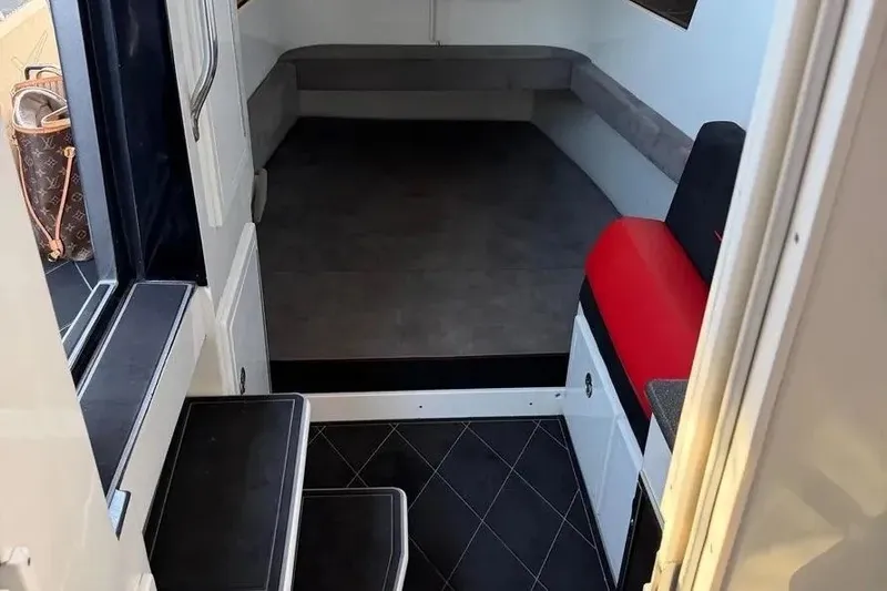 Slide: The Image of Interior view of 2021 Concept 44' Open Deck boat with seating and steps. - 52