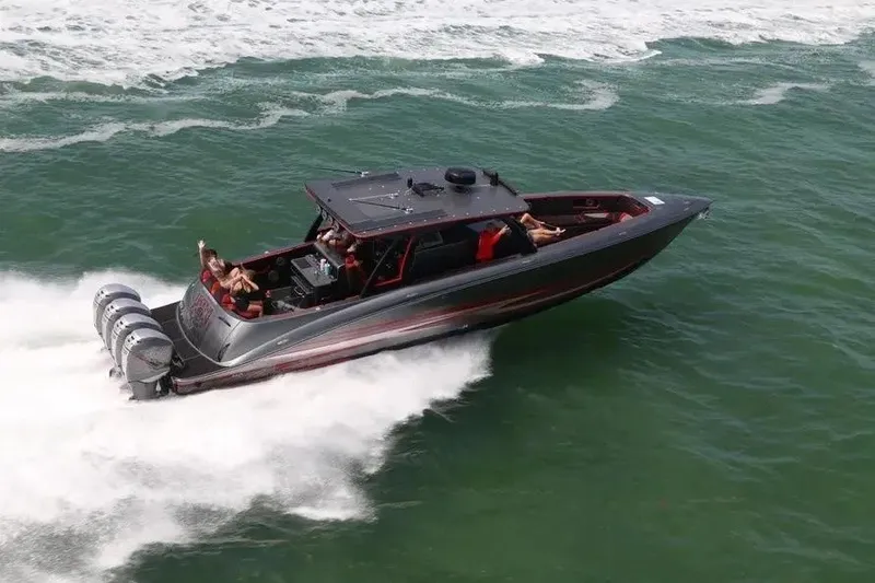 Slide: The Image of 2021 Concept 44' Open Deck boat speeding on ocean waters with multiple outboard engines. - 19