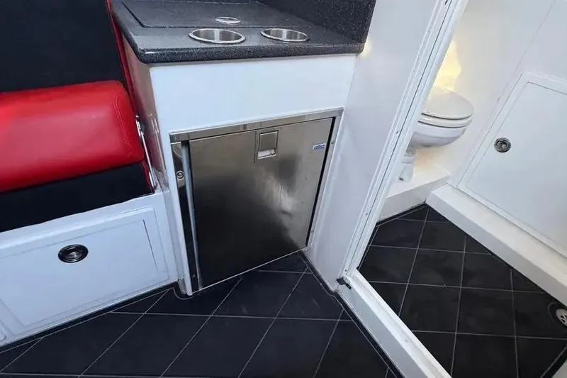 Slide: The Image of Interior of 2021 Concept 44' Open Deck boat with kitchenette and bathroom. - 50