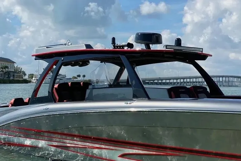 Slide: The Image of 2021 Concept 44' Open Deck boat cruising on a sunny day with bridge in background. - 27
