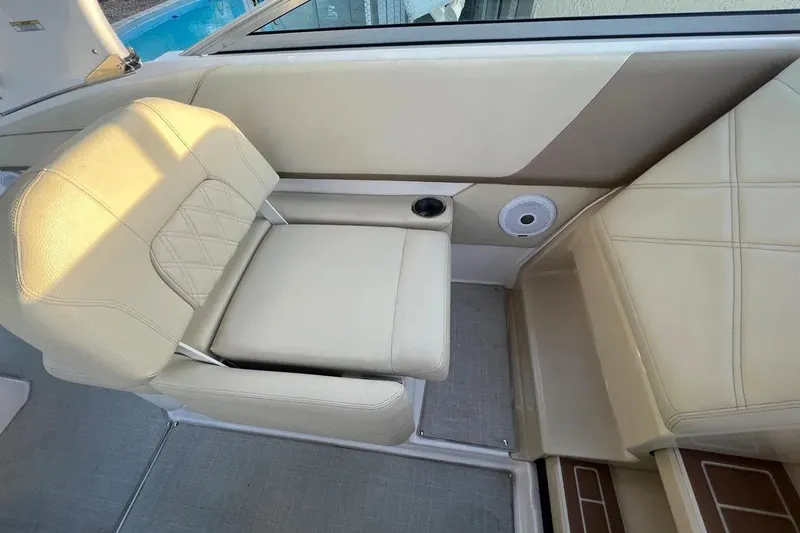 Slide: The Image of Beige seating area on a 2020 Regal 26 XO boat interior. - 23