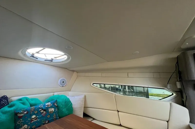 Slide: The Image of Interior of 2020 Regal 26 XO boat with cozy seating and decorative pillows. - 33