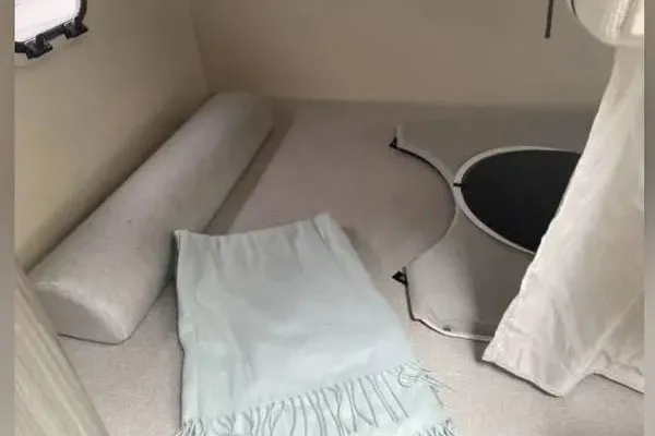 Slide: The Image of Interior cabin of 2020 Regal 26 XO boat with cushions and blanket. - 43