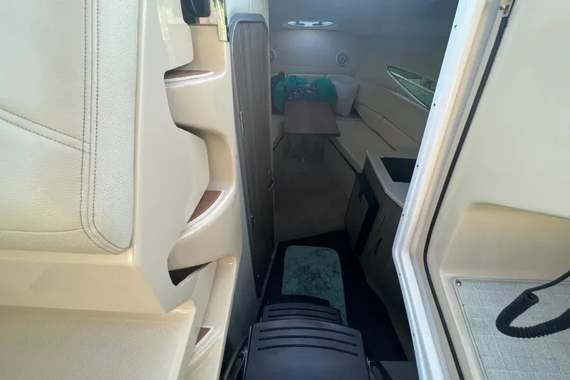 Slide: The Image of Interior cabin of 2020 Regal 26 XO boat with seating and table. - 28
