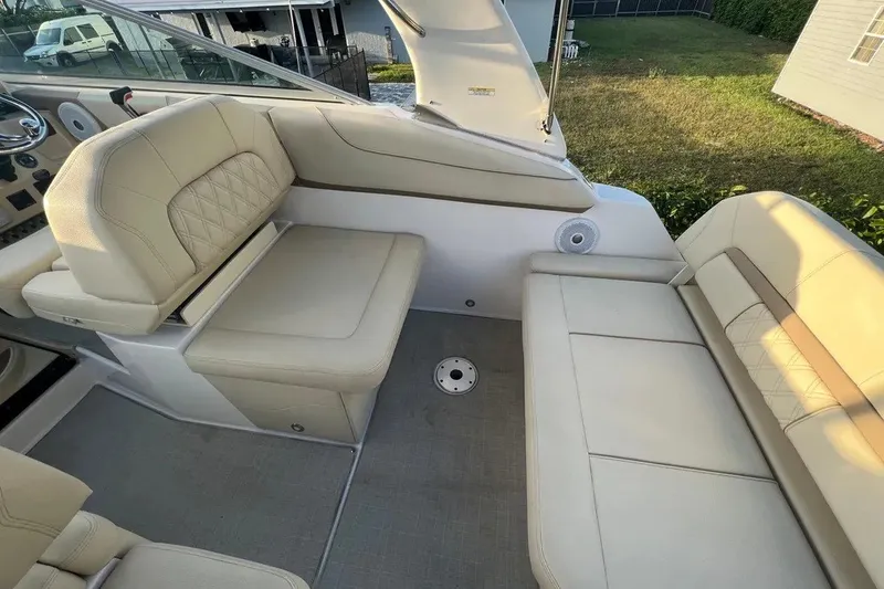 Slide: The Image of 2020 Regal 26 XO boat interior with beige seating and modern design. - 19