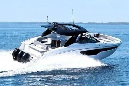 Slide: The Image of 2023 Cruisers Yachts 38 GLS OB speeding on open water. - 4