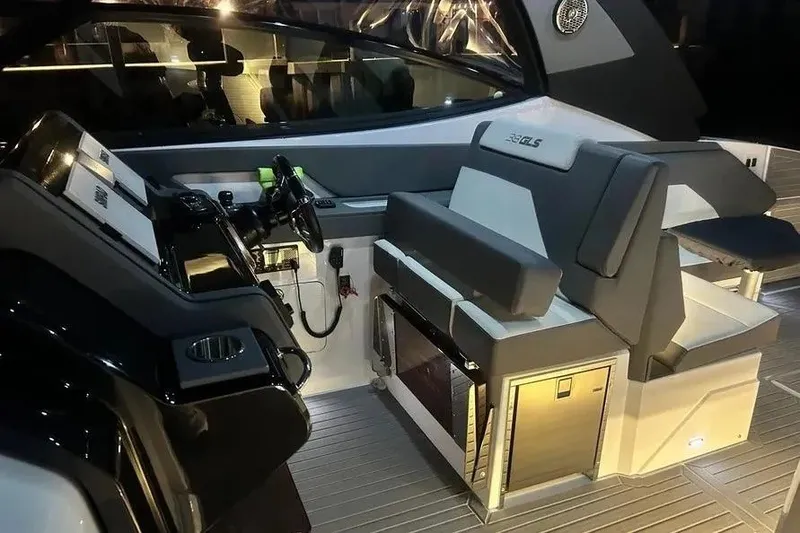 Slide: The Image of 2023 Cruisers Yachts 38 GLS OB cockpit with modern seating and control panel. - 26
