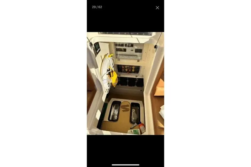 Slide: The Image of Interior view of 2019 Scout 420 LXF boat showing storage and equipment. - 36