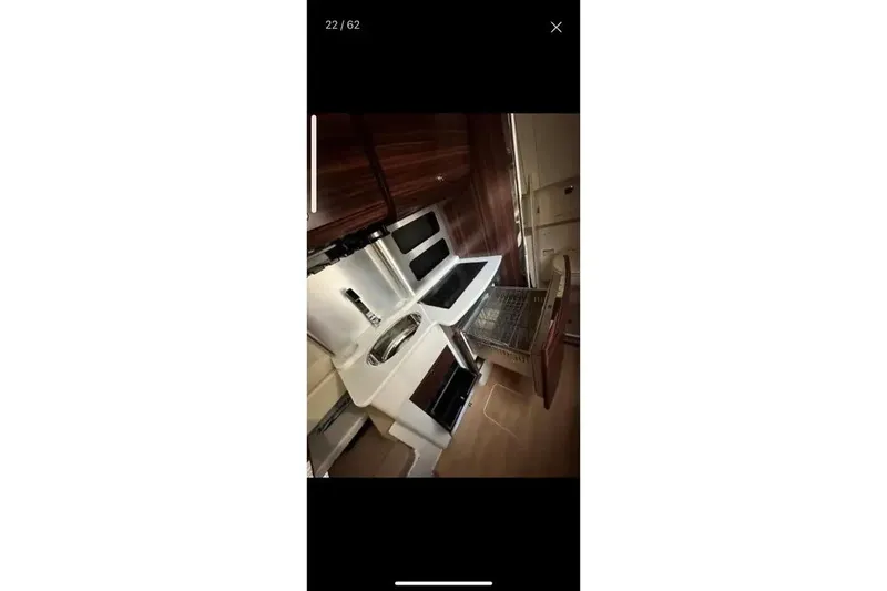 Slide: The Image of Interior view of 2019 Scout 420 LXF yacht kitchen with modern appliances. - 33