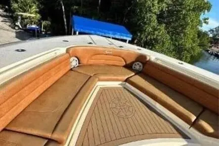 Slide: The Image of Luxurious 2019 Scout 420 LXF boat with spacious seating and elegant design. - 17