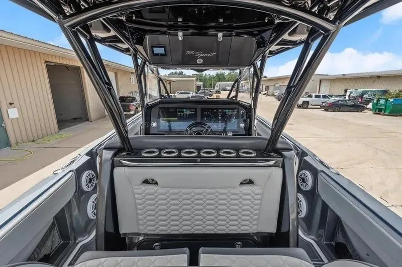 Slide: The Image of 2023 Nor-Tech 390 Center Console interior with modern dashboard and seating. - 12