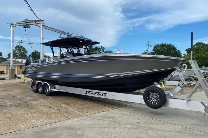 Slide: The Image of 2023 Nor-Tech 390 Center Console boat on trailer, parked outdoors. - 1