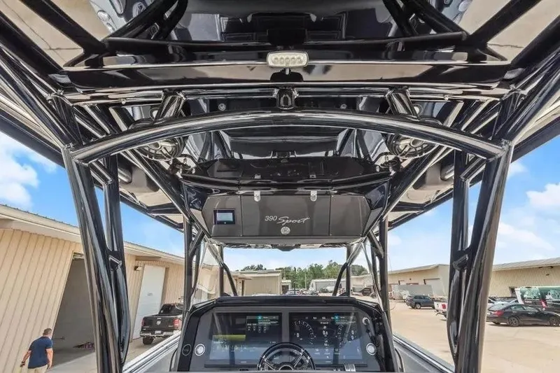 Slide: The Image of 2023 Nor-Tech 390 Center Console boat interior with advanced dashboard and sleek design. - 13