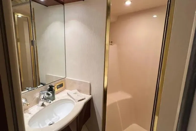 Slide: The Image of Luxurious bathroom in 2004 Lazzara SC Motor Yacht with elegant sink and shower. - 63