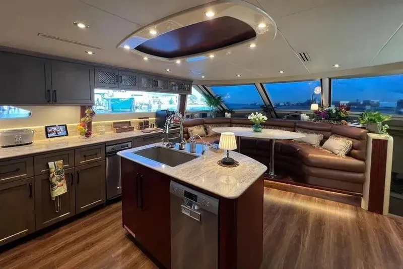 Slide: The Image of Luxurious interior of 2004 Lazzara SC Motor Yacht with modern kitchen and seating area. - 16