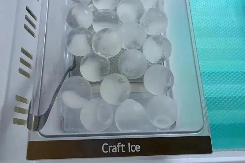 Slide: The Image of Round craft ice balls in a freezer tray, labeled "Craft Ice." - 28