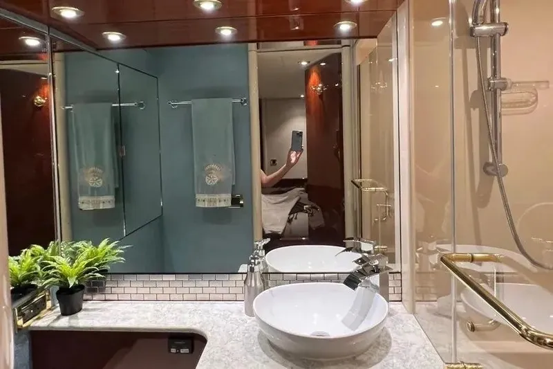 Slide: The Image of Luxurious bathroom interior of a 2004 Lazzara SC Motor Yacht with modern fixtures. - 39