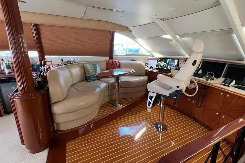 Slide: The Image of Luxurious 2004 Lazzara SC Motor Yacht interior with plush seating and modern helm. - 48