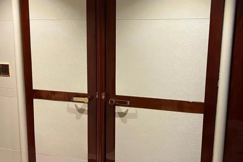 Slide: The Image of Elegant wooden doors inside a 2004 Lazzara SC Motor Yacht. - 36