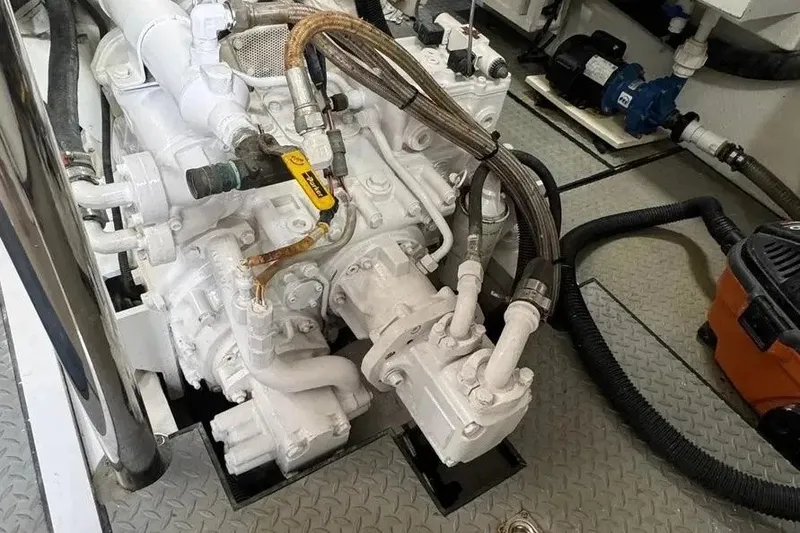 Slide: The Image of Engine room of a 2004 Lazzara SC Motor Yacht, showcasing mechanical components. - 72