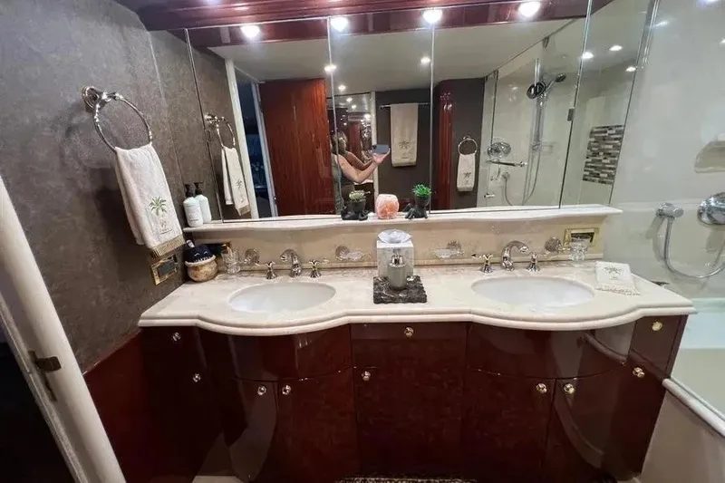 Slide: The Image of Luxurious bathroom in a 2004 Lazzara SC Motor Yacht with dual sinks and elegant decor. - 32