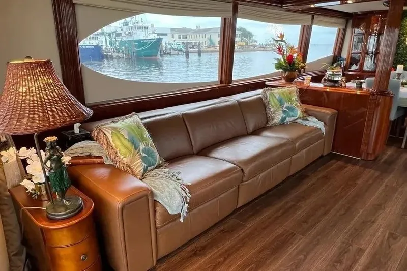 Slide: The Image of Luxurious interior of 2004 Lazzara SC Motor Yacht with leather sofa and waterfront view. - 14