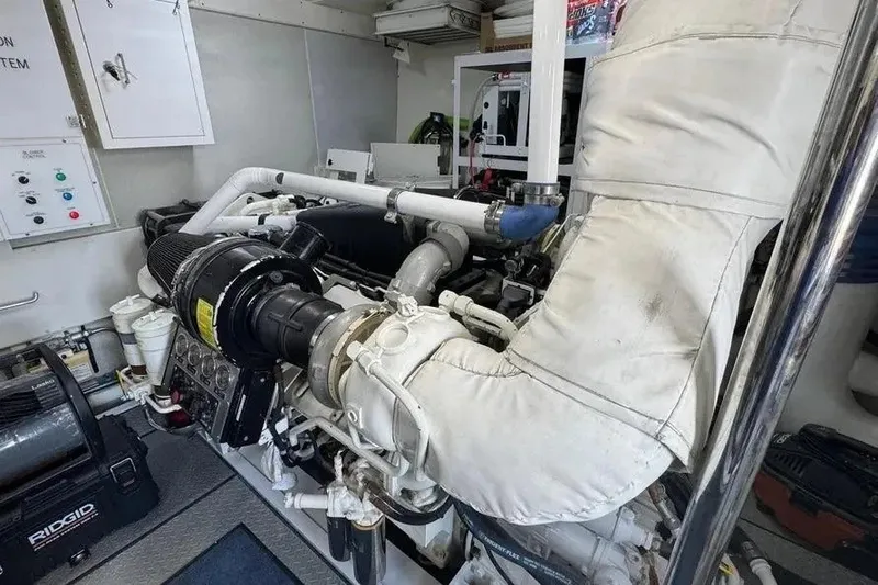 Slide: The Image of Engine room of 2004 Lazzara SC Motor Yacht with visible machinery and piping. - 70