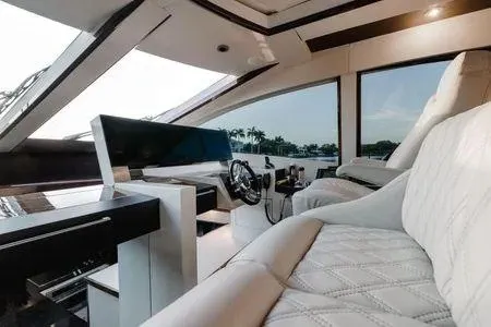 Slide: The Image of Luxurious interior of a 2007 Lazzara LSX 75 yacht with plush seating and modern controls. - 48