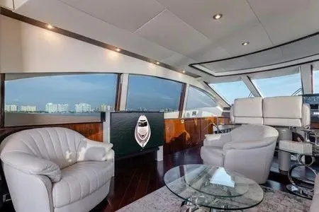 Slide: The Image of Luxurious interior of 2007 Lazzara LSX 75 yacht with panoramic windows and plush seating. - 32
