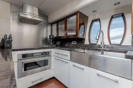 Slide: The Image of Modern kitchen in 2007 Lazzara LSX 75 yacht with stainless steel appliances and sleek cabinetry. - 21
