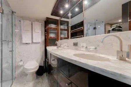 Slide: The Image of Luxurious bathroom in a 2007 Lazzara LSX 75 yacht with marble countertops and modern fixtures. - 45