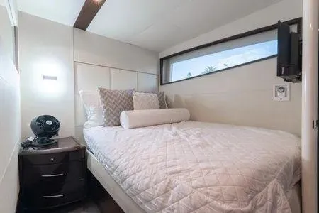 Slide: The Image of Luxurious bedroom interior on 2007 Lazzara LSX 75 yacht with modern decor and window view. - 38