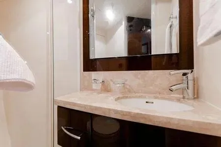 Slide: The Image of Luxurious bathroom in a 2007 Lazzara LSX 75 yacht with elegant fixtures and marble countertop. - 17