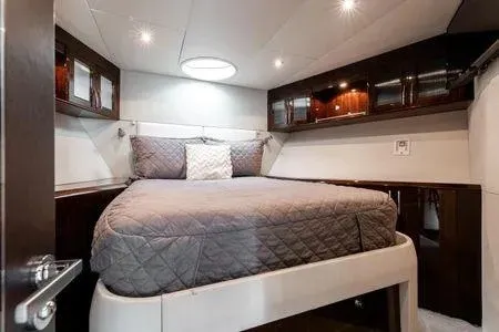 Slide: The Image of Luxurious bedroom interior of 2007 Lazzara LSX 75 yacht with elegant bedding and ambient lighting. - 15