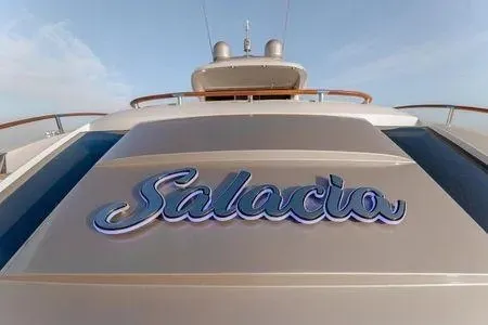 Slide: The Image of 2007 Lazzara LSX 75 yacht with "Salacio" nameplate, sleek design, and elegant finish. - 36