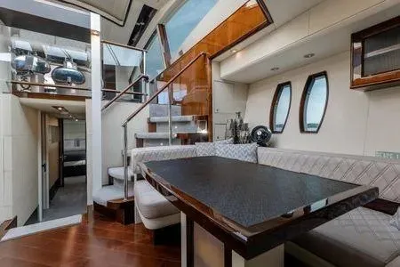 Slide: The Image of Luxurious interior of 2007 Lazzara LSX 75 yacht with modern dining area and staircase. - 24