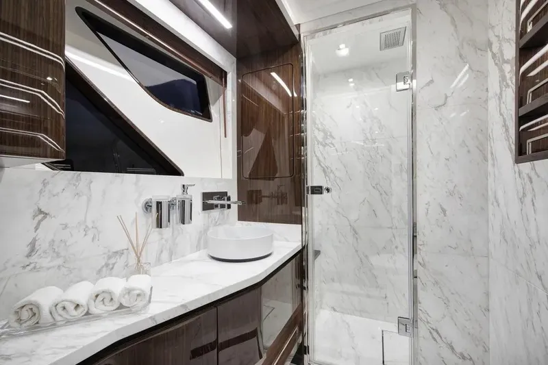 Slide: The Image of Luxurious bathroom in 2023 Lazzara LSX 67 yacht with marble and wood finishes. - 22