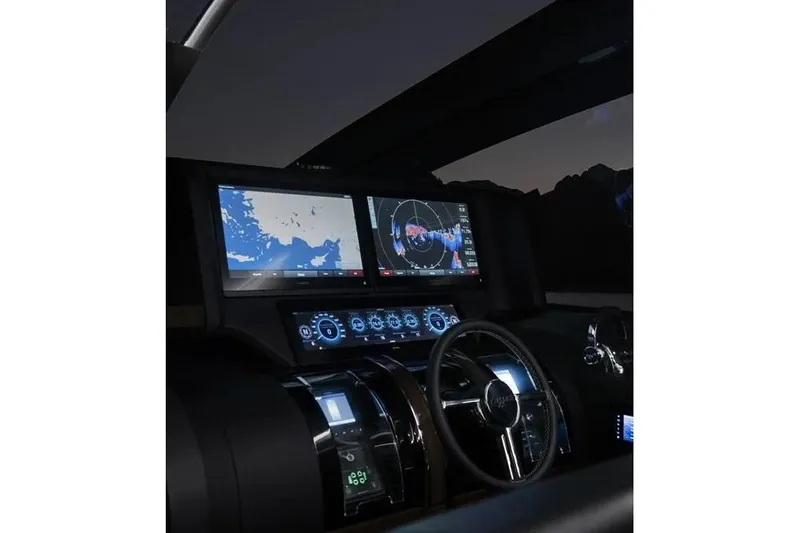 Slide: The Image of Cockpit of 2023 Lazzara LSX 67 yacht with advanced navigation displays and controls. - 14