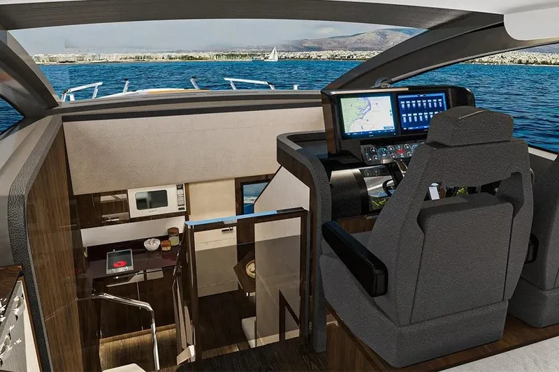 Slide: The Image of Interior view of 2023 Lazzara LSX 67 yacht with modern helm and kitchen area. - 16