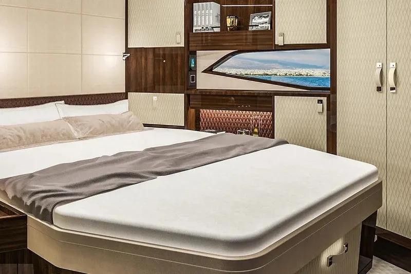 Slide: The Image of Luxurious bedroom interior of 2023 Lazzara LSX 67 yacht with elegant wood finishes. - 24