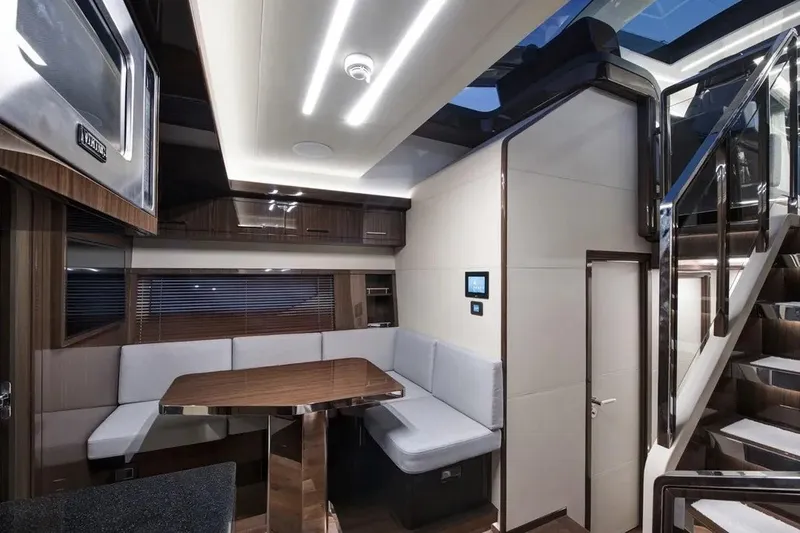 Slide: The Image of Luxurious interior of 2023 Lazzara LSX 67 yacht with modern seating and sleek design. - 18