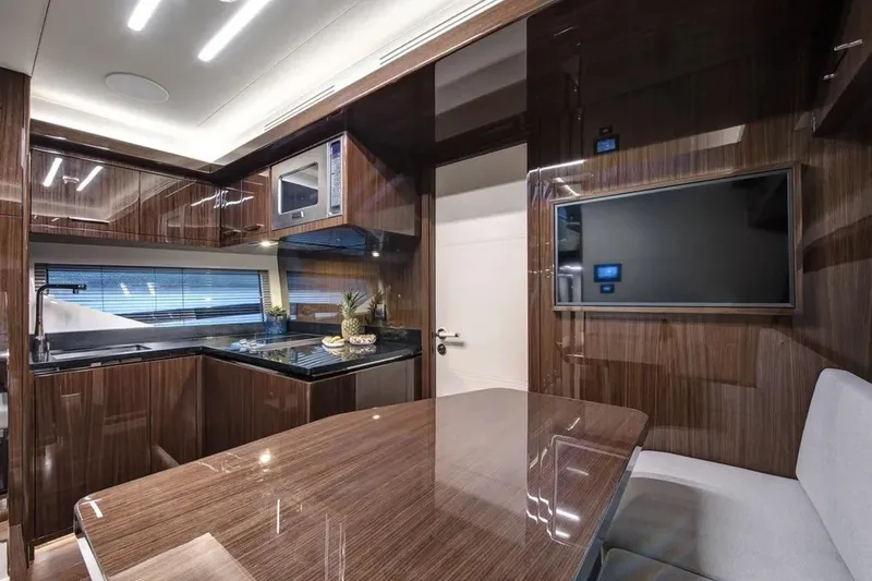 Slide: The Image of Luxurious interior of 2023 Lazzara LSX 67 yacht with modern kitchen and dining area. - 21